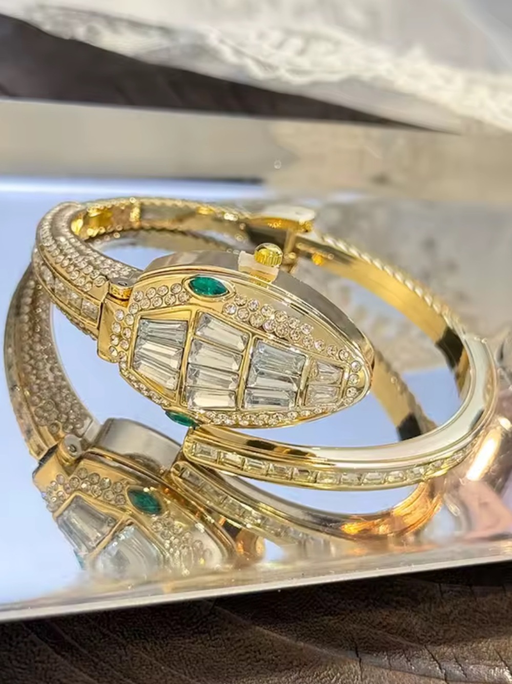 Gold and White Crystal Bangle Bracelet with Emerald Accents watch